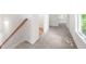 Carpeted hallway with staircase and natural light at 2975 Jefferson St, Austell, GA 30106