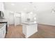Open kitchen with granite countertops, white cabinets, and stainless steel appliances at 2975 Jefferson St, Austell, GA 30106