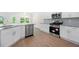 Modern kitchen with stainless steel appliances, sleek countertops, and ample cabinet space at 2975 Jefferson St, Austell, GA 30106