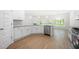 Bright and airy kitchen with stainless steel appliances, an island, and granite countertops at 2975 Jefferson St, Austell, GA 30106