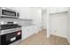 Well-equipped kitchen with stainless steel appliances, granite countertops, and white cabinets at 2975 Jefferson St, Austell, GA 30106