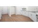 Bright kitchen features white cabinets, granite countertops, and stainless steel sink at 2975 Jefferson St, Austell, GA 30106