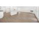 Bright open-concept living space with wood-look floors and modern finishes at 2975 Jefferson St, Austell, GA 30106