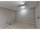 Unfinished basement with carpet and track lighting at 6010 Somerset Ct, Suwanee, GA 30024