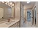 Bright bathroom with a stylish vanity, sink, and lighting fixture over a large mirror at 6010 Somerset Ct, Suwanee, GA 30024
