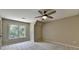 Bedroom with large window with a view and a ceiling fan for comfort at 6010 Somerset Ct, Suwanee, GA 30024