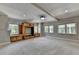 Bonus room with a built-in entertainment center and plenty of natural light at 6010 Somerset Ct, Suwanee, GA 30024