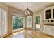 Cozy breakfast nook with large windows, natural light, and exterior access to the deck at 6010 Somerset Ct, Suwanee, GA 30024