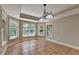 Bright breakfast nook featuring tile floors, natural light from multiple windows and updated lighting fixture at 6010 Somerset Ct, Suwanee, GA 30024