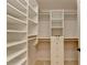Custom walk-in closet with built-in shelving and drawers for optimal storage at 6010 Somerset Ct, Suwanee, GA 30024