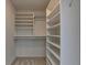 Walk-in closet featuring an organization system with shelves and rods at 6010 Somerset Ct, Suwanee, GA 30024