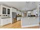 Spacious kitchen features stainless steel appliances, recessed lighting, and white cabinetry at 6010 Somerset Ct, Suwanee, GA 30024