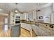 Beautiful kitchen with granite counters, stainless appliances, an island and stylish backsplash at 6010 Somerset Ct, Suwanee, GA 30024