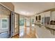 Bright kitchen features hardwood floors, granite countertops and stainless steel appliances at 6010 Somerset Ct, Suwanee, GA 30024