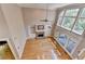 Grand living room boasts soaring ceilings, large windows, fireplace, and hardwood floors at 6010 Somerset Ct, Suwanee, GA 30024