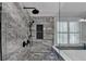 Modern shower with sleek fixtures, rainfall shower head, and elegant tile surround at 6010 Somerset Ct, Suwanee, GA 30024