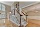 Bright open floor plan with elegant staircase and hardwood floors at 6010 Somerset Ct, Suwanee, GA 30024