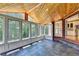 Inviting sunroom with wood ceiling, tiled floor, and expansive windows offering natural light and views at 6010 Somerset Ct, Suwanee, GA 30024