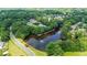 Aerial view showing a scenic lake and community amenities enhancing neighborhood appeal at 12160 Oak Hollow Way, Alpharetta, GA 30005