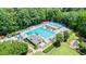 Aerial view showcasing a luxurious community pool and recreation area with playground at 12160 Oak Hollow Way, Alpharetta, GA 30005