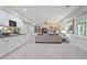 The expansive basement features a kitchen counter, living space and ample natural light at 12160 Oak Hollow Way, Alpharetta, GA 30005