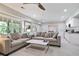 This finished basement features comfortable seating, a kitchen counter and natural lighting at 12160 Oak Hollow Way, Alpharetta, GA 30005
