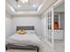This gray basement bedroom features a full size bed, recessed lighting and a small closet at 12160 Oak Hollow Way, Alpharetta, GA 30005