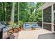 Outdoor deck featuring a grill, flower pots, and comfortable lounge seating at 12160 Oak Hollow Way, Alpharetta, GA 30005