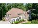 Stately home with manicured lawn and large trees at 12160 Oak Hollow Way, Alpharetta, GA 30005