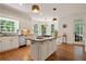 Bright kitchen with granite counters and stainless appliances at 12160 Oak Hollow Way, Alpharetta, GA 30005