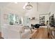 Inviting living room featuring vaulted ceilings, a fireplace, and plenty of natural light at 12160 Oak Hollow Way, Alpharetta, GA 30005