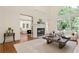 Spacious living room with fireplace and view into the kitchen area at 12160 Oak Hollow Way, Alpharetta, GA 30005