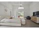 Spacious primary bedroom with tray ceilings and large windows at 12160 Oak Hollow Way, Alpharetta, GA 30005