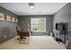 Office featuring paneled walls, carpeted floor, natural light and a desk with rolling office chair at 12160 Oak Hollow Way, Alpharetta, GA 30005