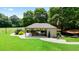 Picnic shelter in lush green park with tables, grill, and ample seating at 12160 Oak Hollow Way, Alpharetta, GA 30005