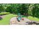 Community playground and adjacent picnic tables, great for outdoor activities and gatherings at 12160 Oak Hollow Way, Alpharetta, GA 30005