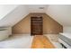 Unfinished attic space featuring bare walls, wood beams, and bright light at 1900 Green Oak Cir, Lawrenceville, GA 30043