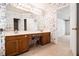 Large Primary bathroom features dual vanities, tiled floors, and decorative wallpaper leading to the bedroom at 1900 Green Oak Cir, Lawrenceville, GA 30043