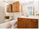 Bathroom featuring tile flooring, wooden cabinets, and a shower with glass door at 1900 Green Oak Cir, Lawrenceville, GA 30043