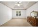 Large bedroom with neutral carpet, crown molding, a ceiling fan, and a large window at 1900 Green Oak Cir, Lawrenceville, GA 30043