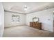 Spacious bedroom with tray ceiling, carpet, natural light, dresser, and decorative crown molding at 1900 Green Oak Cir, Lawrenceville, GA 30043