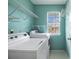 Laundry room with modern washer and dryer and plenty of storage shelves at 1900 Green Oak Cir, Lawrenceville, GA 30043