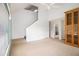 Open living room with neutral carpet, bright light, and a staircase in view at 1900 Green Oak Cir, Lawrenceville, GA 30043