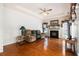A spacious living room boasts hardwood floors, a fireplace, tray ceiling and bright natural light at 1900 Green Oak Cir, Lawrenceville, GA 30043