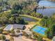 Aerial view of community amenities featuring pool, clubhouse, playground, and tennis courts at 219 Sleepy Way, Canton, GA 30114