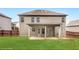 Grassy backyard featuring a covered patio, privacy fence, and mature trees at 219 Sleepy Way, Canton, GA 30114