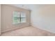 This bright bedroom features neutral walls, soft carpet, and a window with blinds at 219 Sleepy Way, Canton, GA 30114