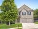 Beautiful two-story brick home with a well-manicured lawn and a two-car attached garage at 219 Sleepy Way, Canton, GA 30114