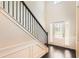 Elegant foyer with hardwood floors, staircase with iron railings, and a bright front door at 219 Sleepy Way, Canton, GA 30114