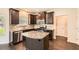Well-equipped kitchen features granite countertops and modern stainless steel appliances at 219 Sleepy Way, Canton, GA 30114